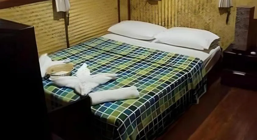 Bed in Green Cottage Beach Resort