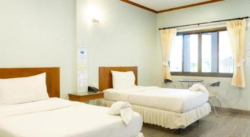 Bed in Manee Sangkha Hotel