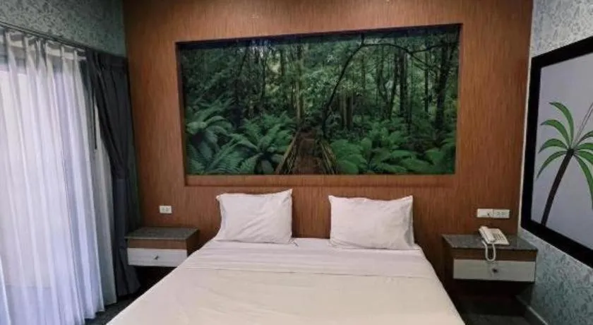 Bed in Manee Sangkha Hotel