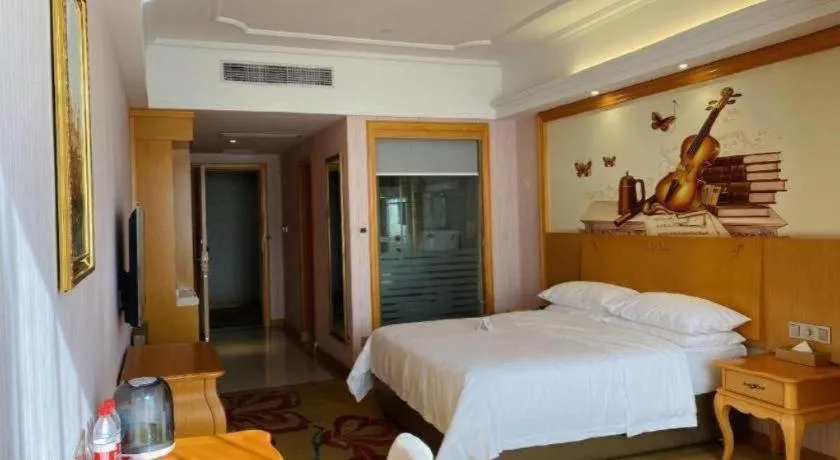 Bed in Vienna Hotel Guangdong Xinyi Jiaoyucheng River View
