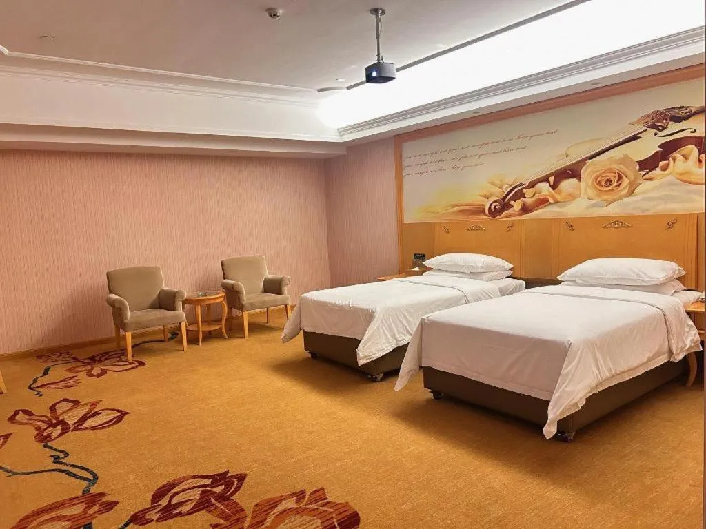 Bed in Vienna Hotel Guangdong Xinyi Jiaoyucheng River View