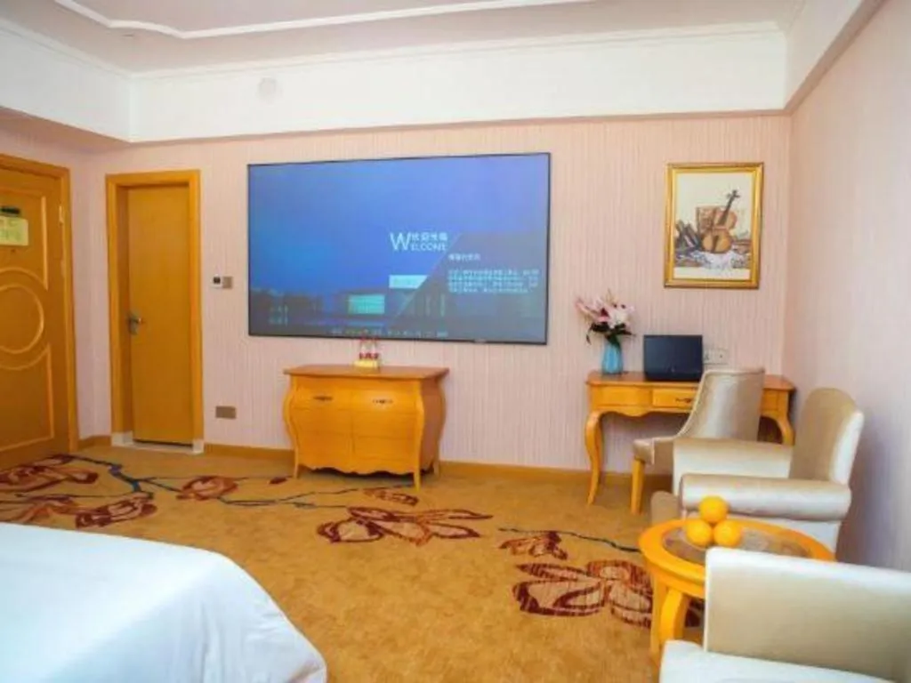 Bed in Vienna Hotel Guangdong Xinyi Jiaoyucheng River View