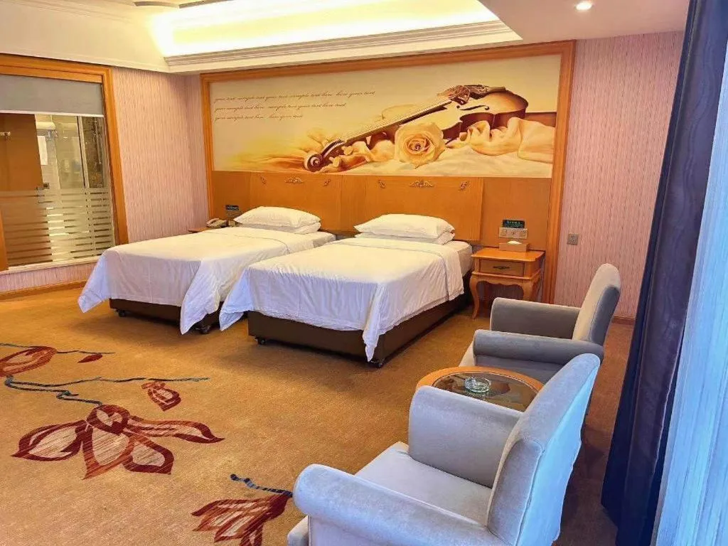 Bed in Vienna Hotel Guangdong Xinyi Jiaoyucheng River View