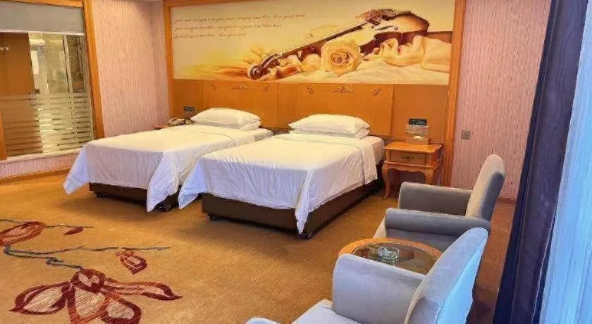 Bed in Vienna Hotel Guangdong Xinyi Jiaoyucheng River View