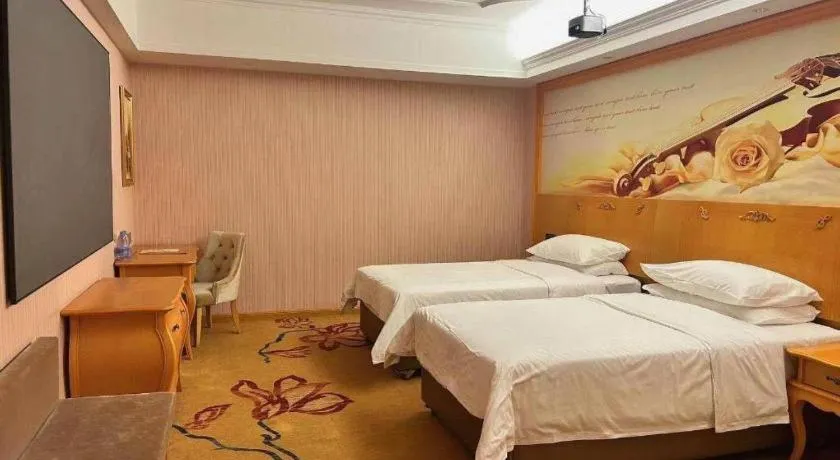 Bed in Vienna Hotel Guangdong Xinyi Jiaoyucheng River View