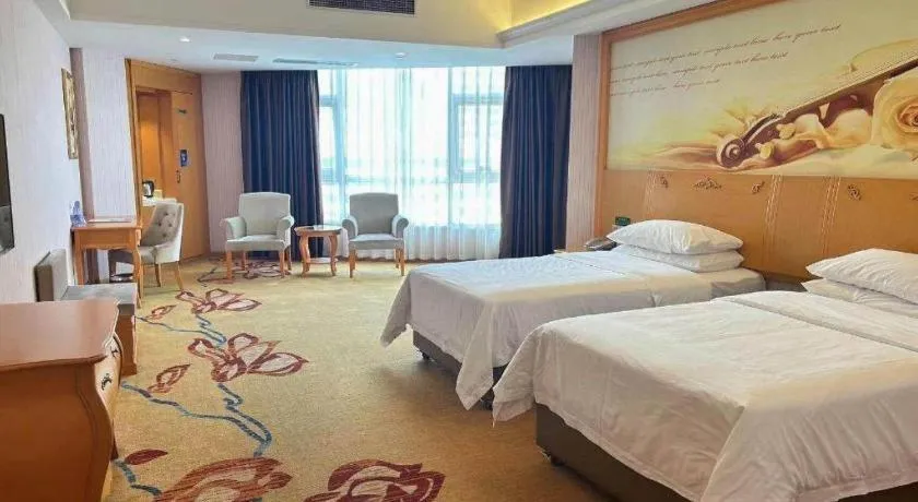 Bed in Vienna Hotel Guangdong Xinyi Jiaoyucheng River View