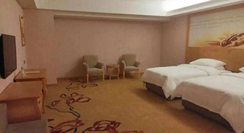 Bed in Vienna Hotel Guangdong Xinyi Jiaoyucheng River View
