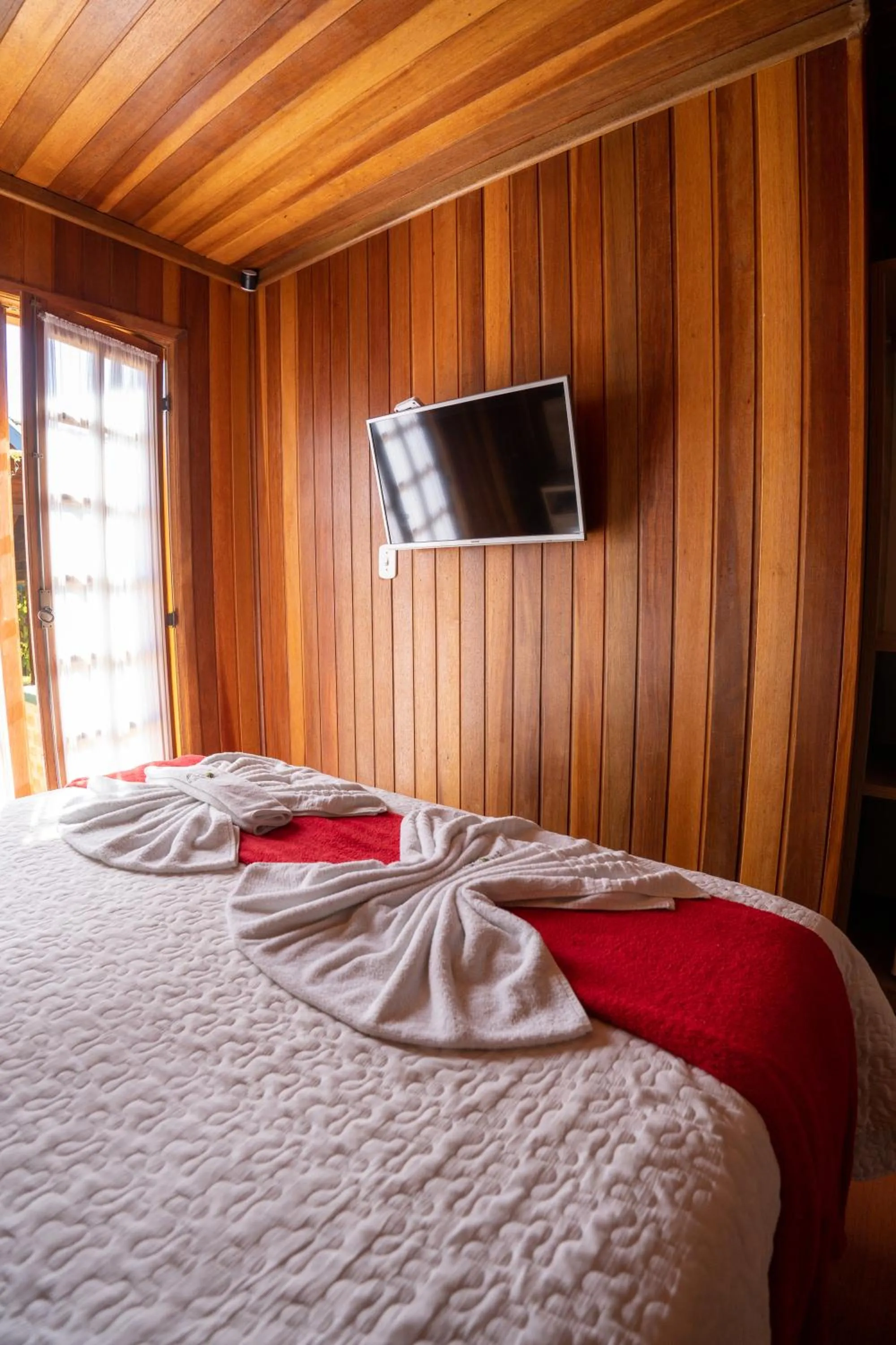 Bed in Pousada Recanto Ninho Verde Chalés