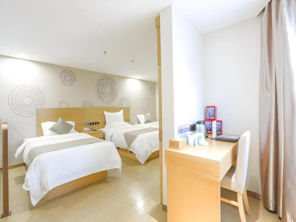 Bed in GreenTree Inn Zhangjiagang Yangshe Old Street Stadium