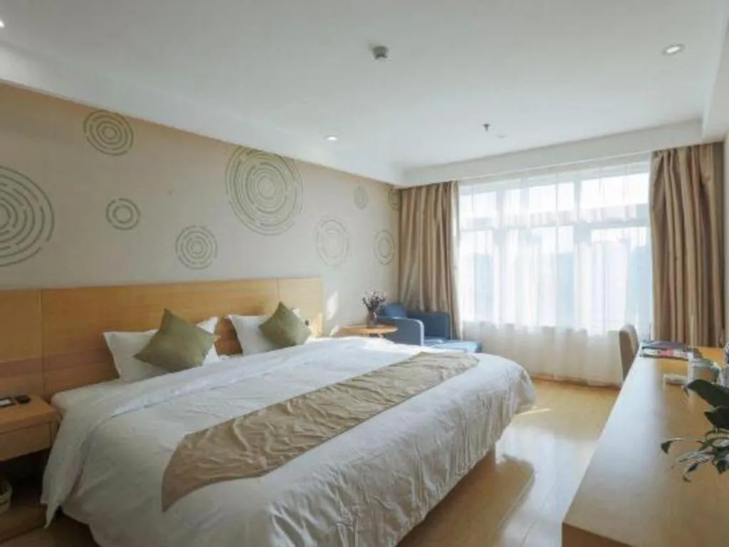 Bed in GreenTree Inn Zhangjiagang Yangshe Old Street Stadium