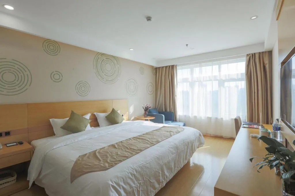 Bed in GreenTree Inn Zhangjiagang Yangshe Old Street Stadium