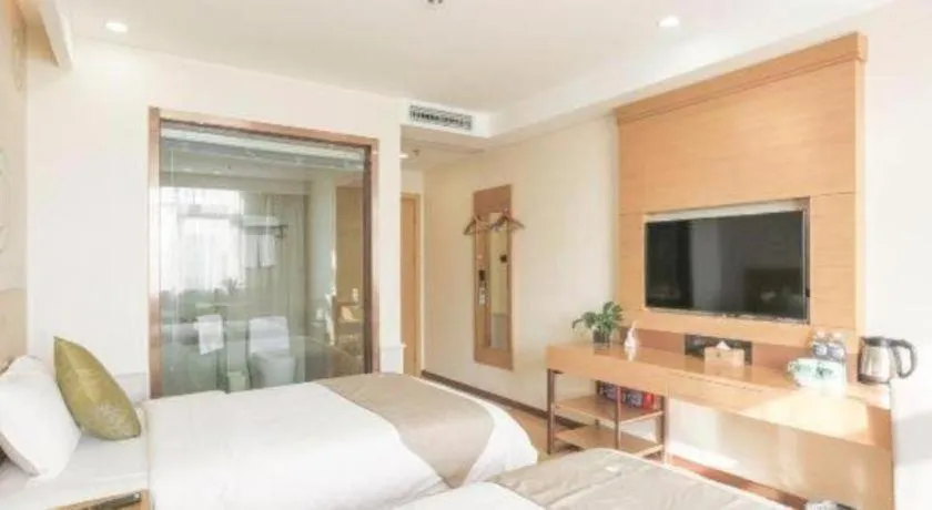 Bed in GreenTree Inn Zhangjiagang Yangshe Old Street Stadium