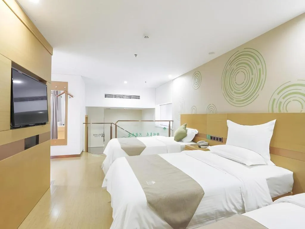 Bed in GreenTree Inn Zhangjiagang Yangshe Old Street Stadium