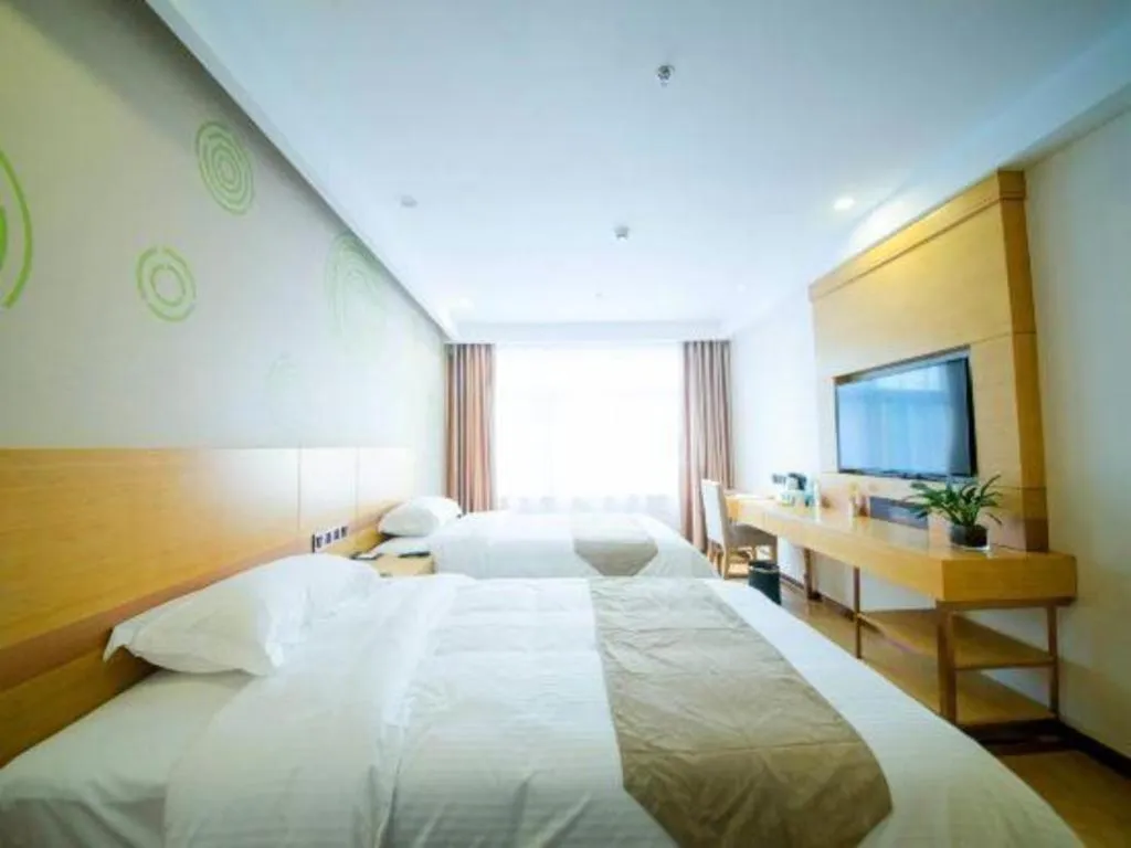 Bed in GreenTree Inn Zhangjiagang Yangshe Old Street Stadium