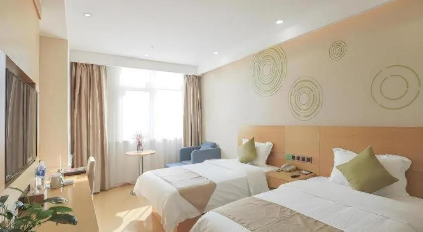 Bed in GreenTree Inn Zhangjiagang Yangshe Old Street Stadium