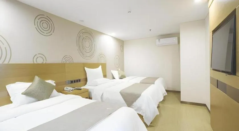 Bed in GreenTree Inn Zhangjiagang Yangshe Old Street Stadium