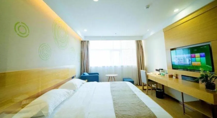 Bed in GreenTree Inn Zhangjiagang Yangshe Old Street Stadium
