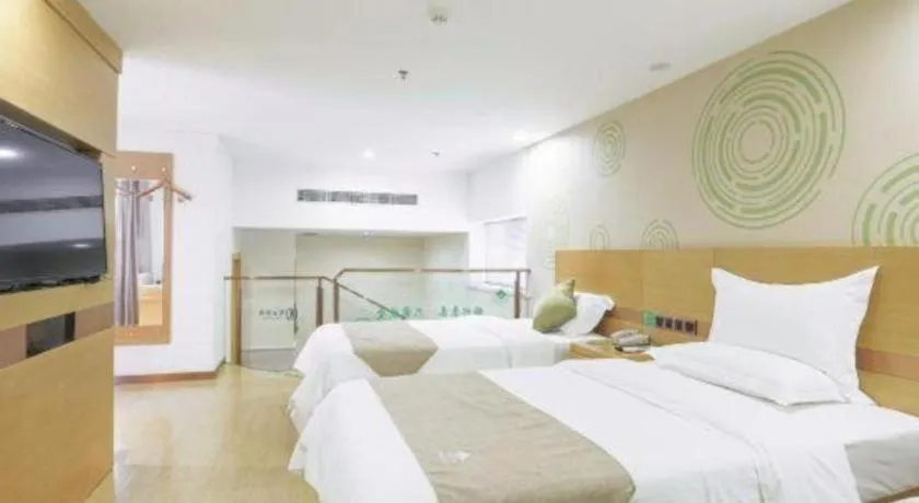 Bed in GreenTree Inn Zhangjiagang Yangshe Old Street Stadium