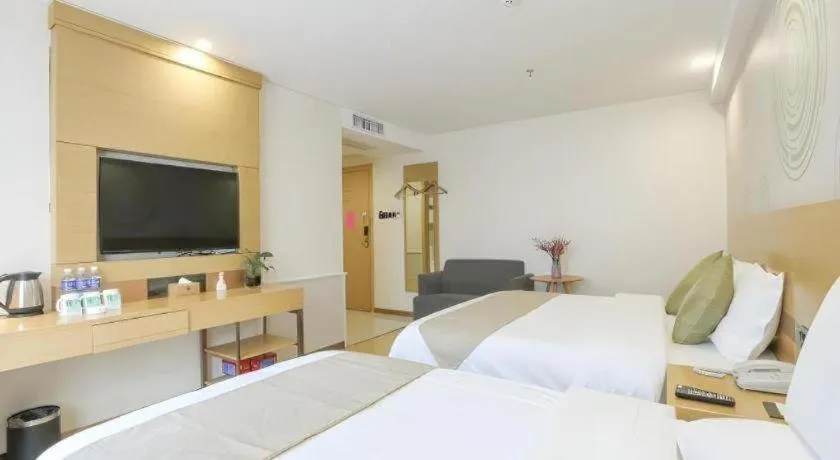 Bed in GreenTree Inn Zhangjiagang Yangshe Old Street Stadium