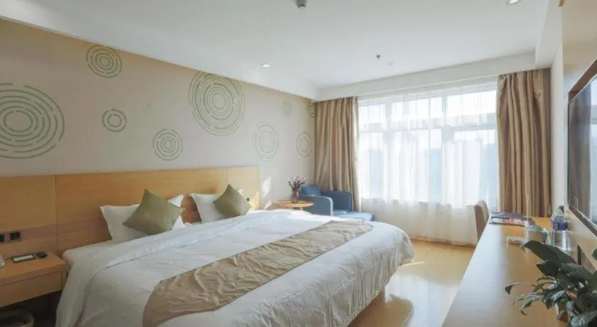 Bed in GreenTree Inn Zhangjiagang Yangshe Old Street Stadium