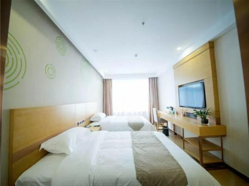 Bed in GreenTree Inn Zhangjiagang Yangshe Old Street Stadium