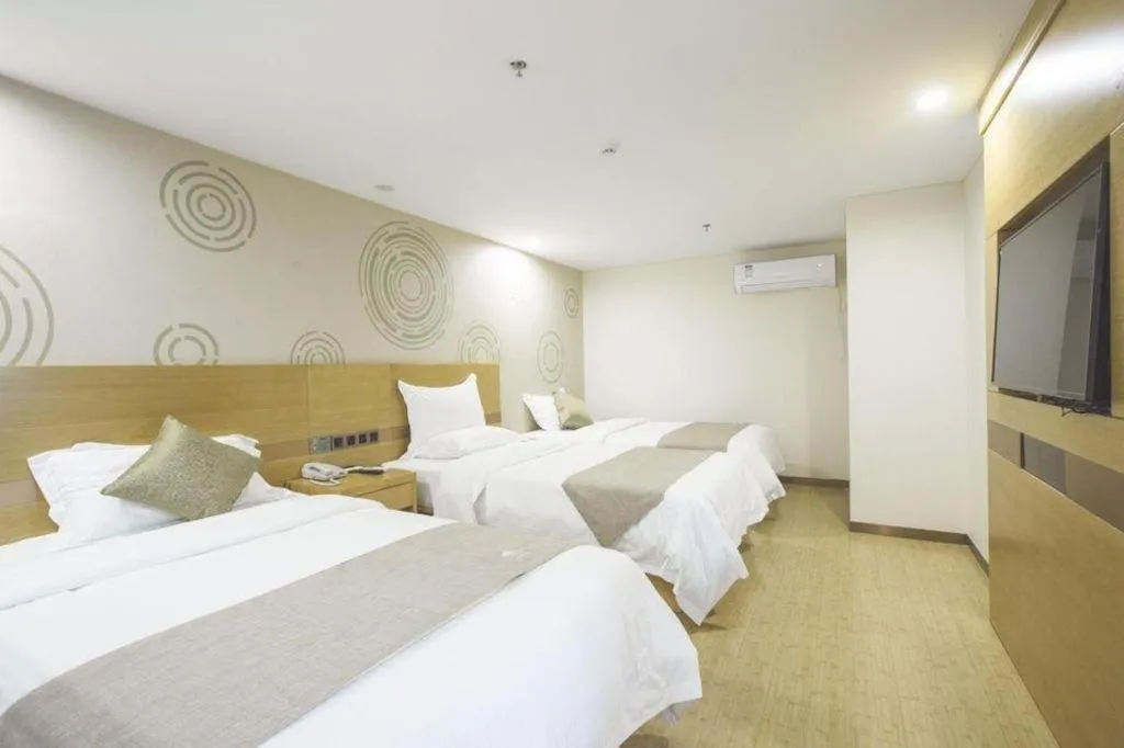 Bed in GreenTree Inn Zhangjiagang Yangshe Old Street Stadium