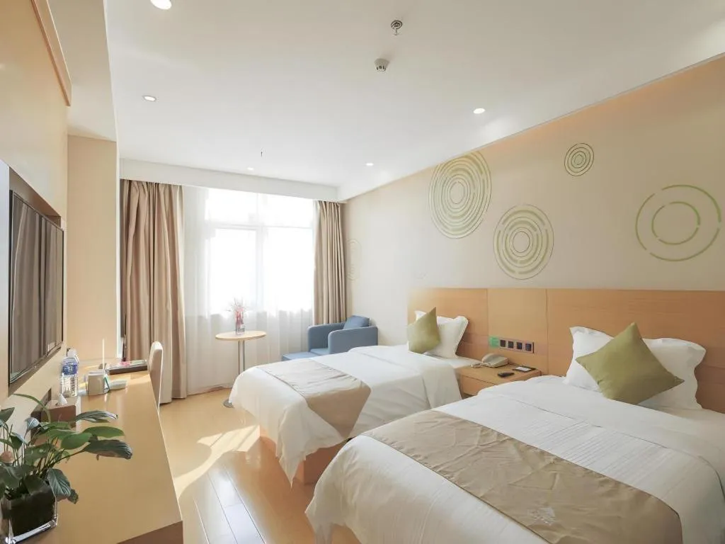 Bed in GreenTree Inn Zhangjiagang Yangshe Old Street Stadium