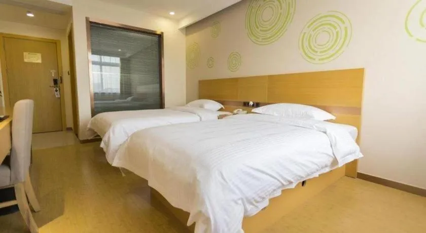 Bed in GreenTree Inn Zhangjiagang Yangshe Old Street Stadium