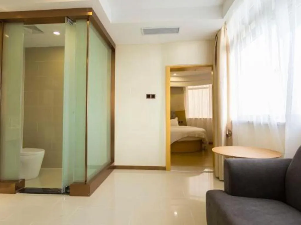 Bed in GreenTree Inn Zhangjiagang Yangshe Old Street Stadium