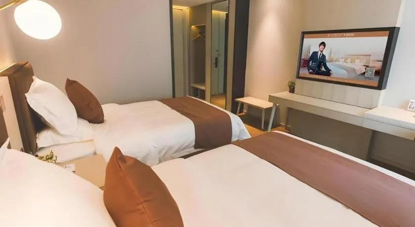 Bed in GYA Shanghai Jiangpu Hotel