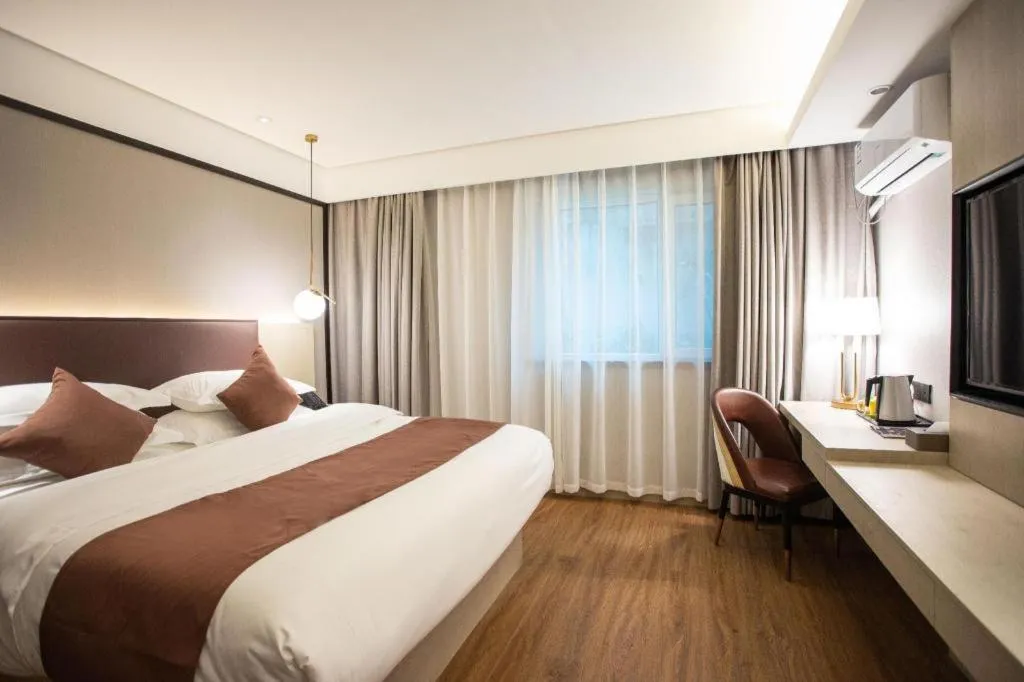 Bed in GYA Shanghai Jiangpu Hotel