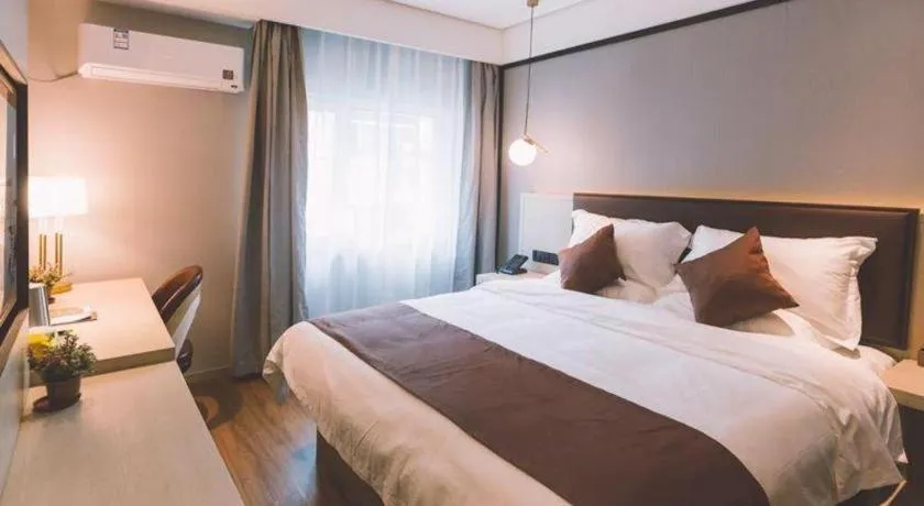 Bed in GYA Shanghai Jiangpu Hotel