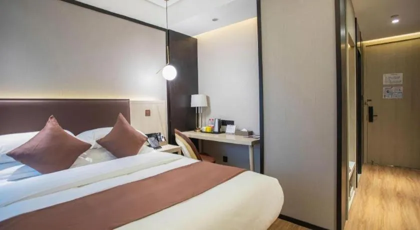 Bed in GYA Shanghai Jiangpu Hotel