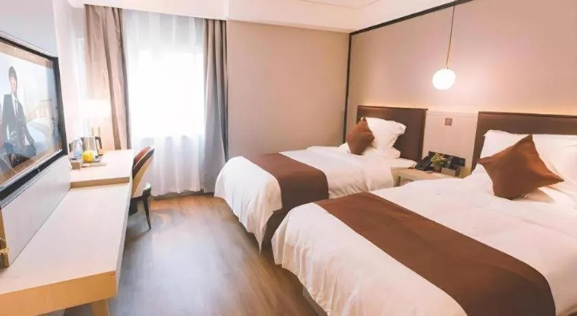 Bed in GYA Shanghai Jiangpu Hotel