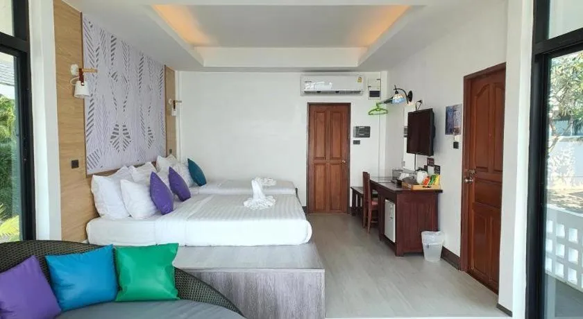 Bed in Rattana Pura Beach Resort