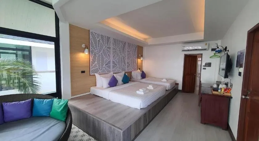 Bed in Rattana Pura Beach Resort