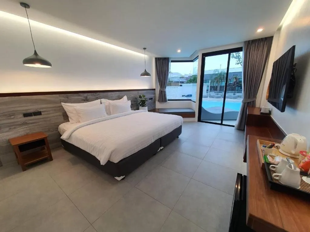 Bed in Rattana Pura Beach Resort