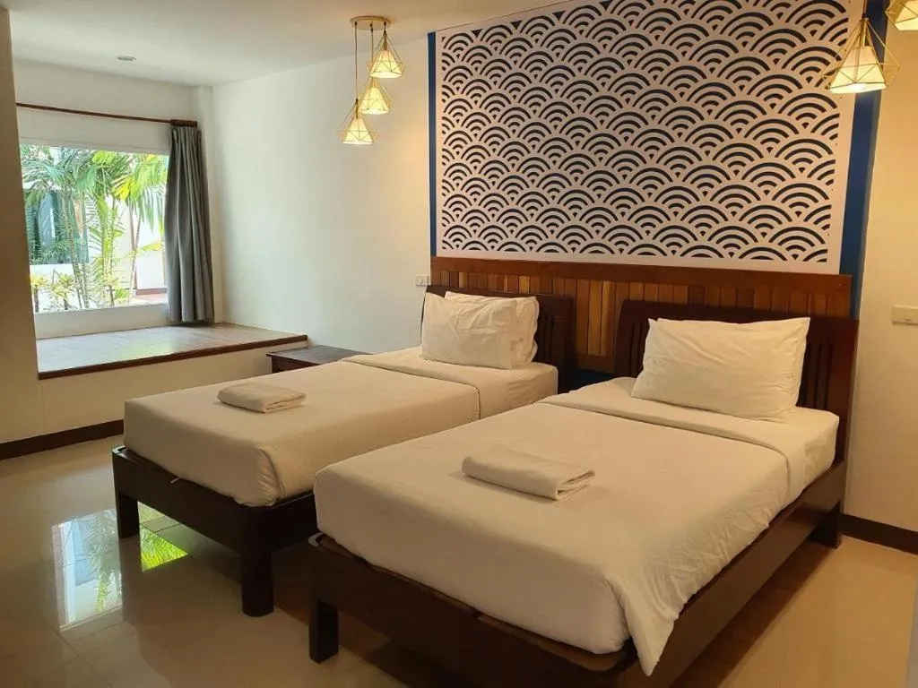 Bed in Rattana Pura Beach Resort