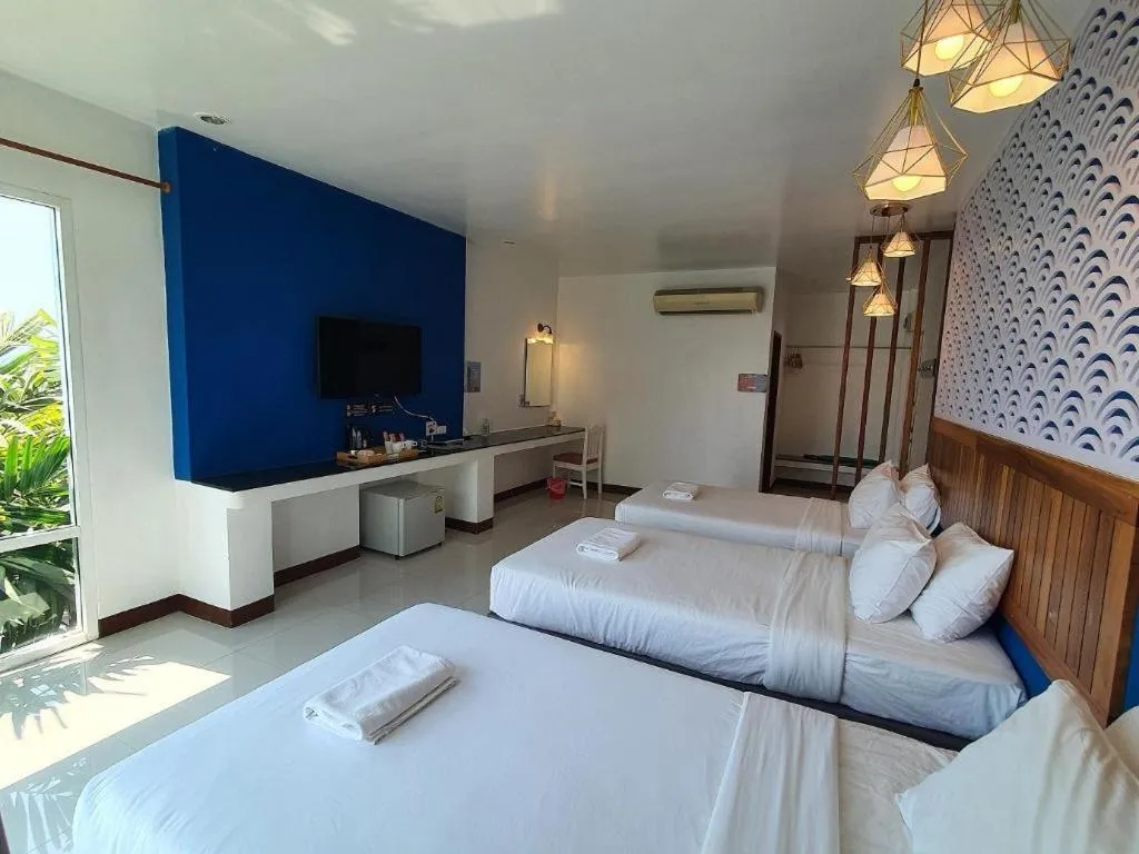 Bed in Rattana Pura Beach Resort