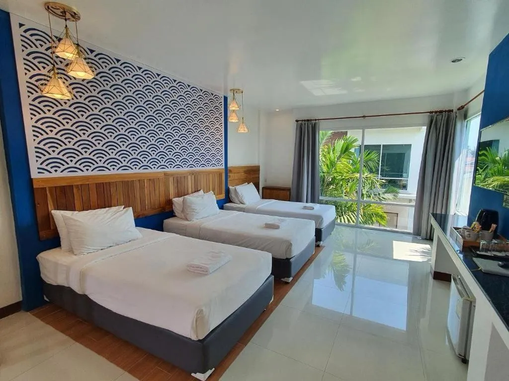 Bed in Rattana Pura Beach Resort