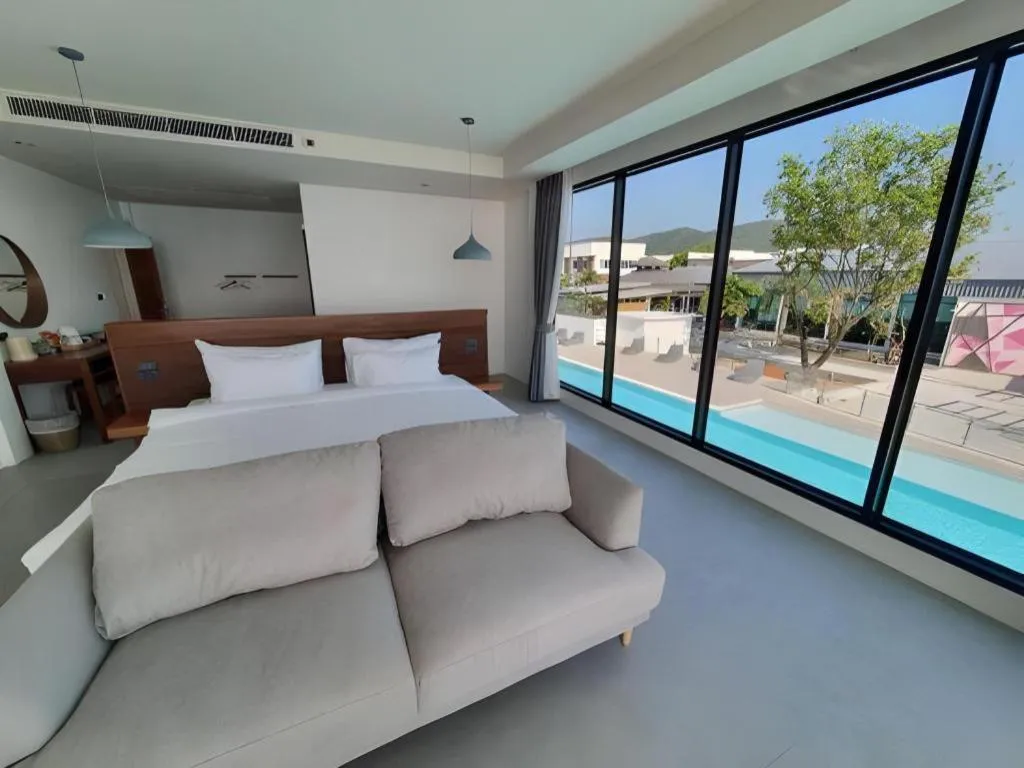 Bed in Rattana Pura Beach Resort