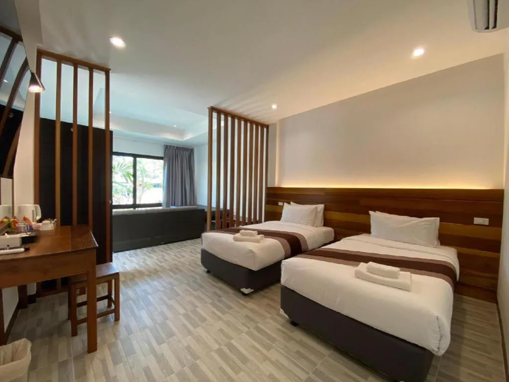 Bed in Rattana Pura Beach Resort