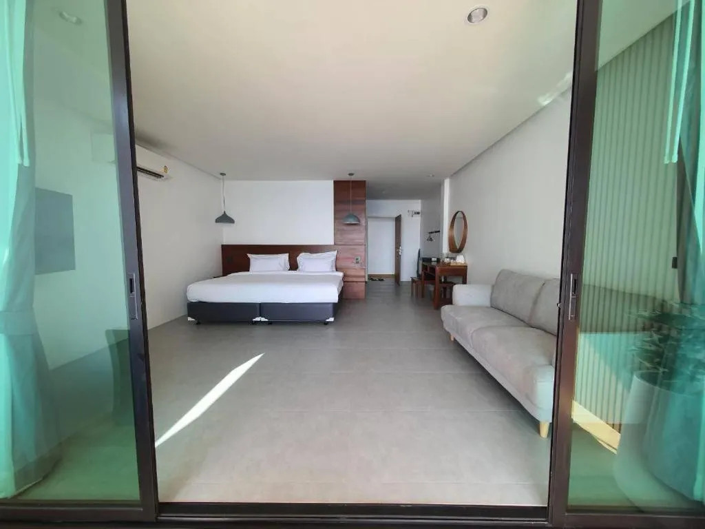 Bed in Rattana Pura Beach Resort