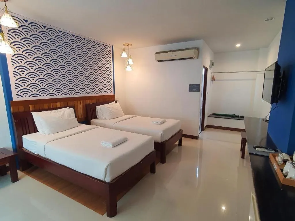 Bed in Rattana Pura Beach Resort