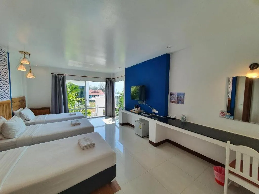 Bed in Rattana Pura Beach Resort