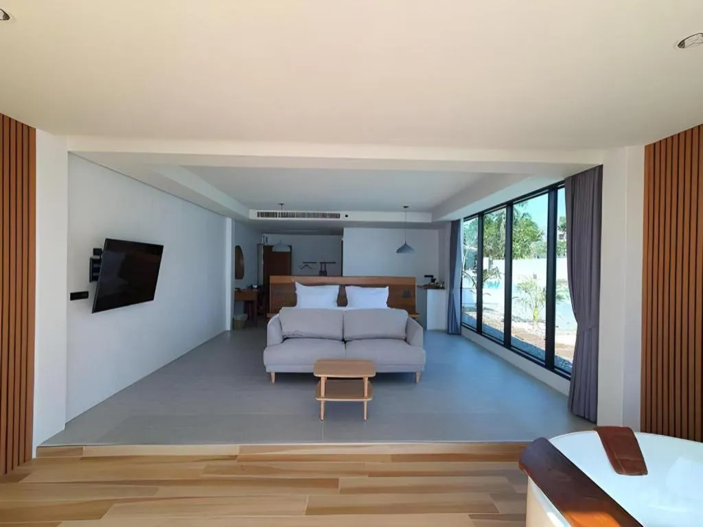 Bed in Rattana Pura Beach Resort