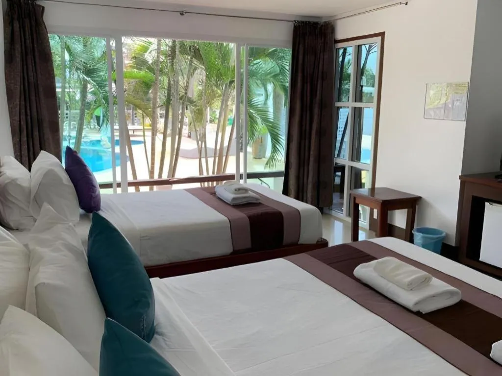 Bed in Rattana Pura Beach Resort