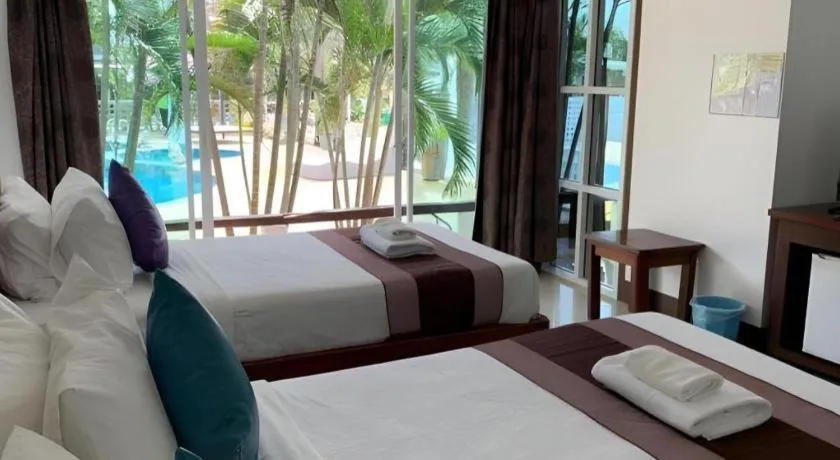 Bed in Rattana Pura Beach Resort