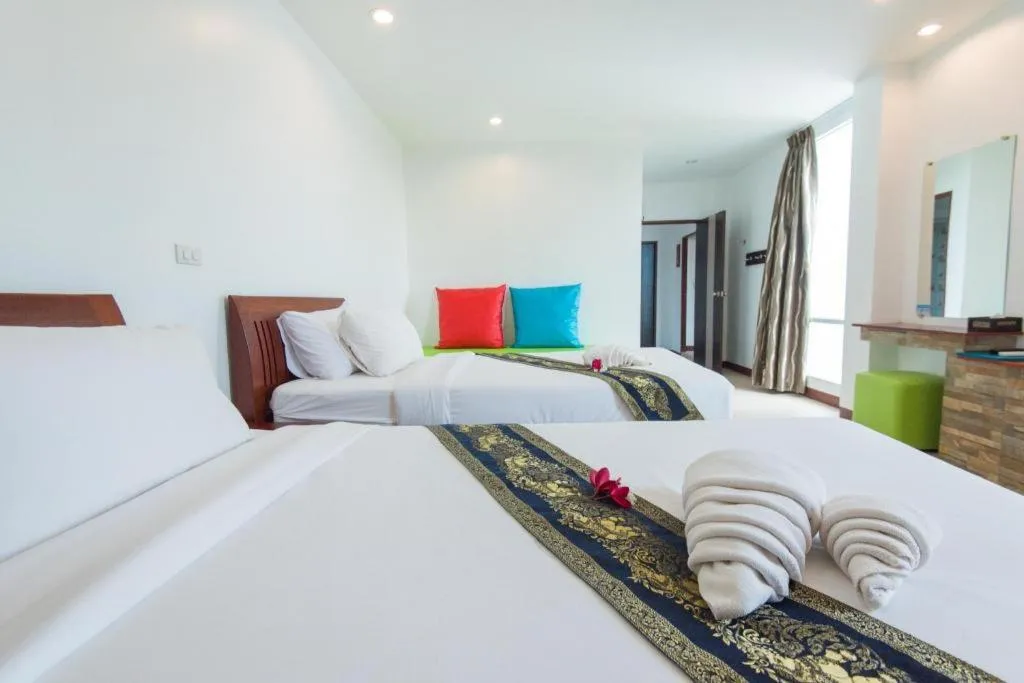 Bed in Rattana Pura Beach Resort