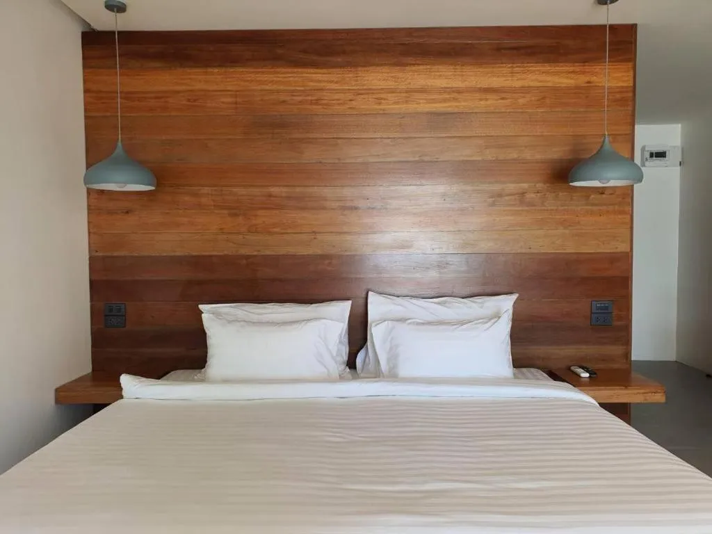 Bed in Rattana Pura Beach Resort